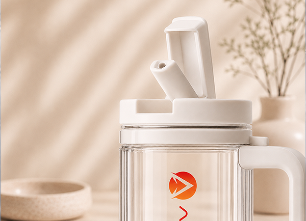White glass mug with handle and lid on a neutral background