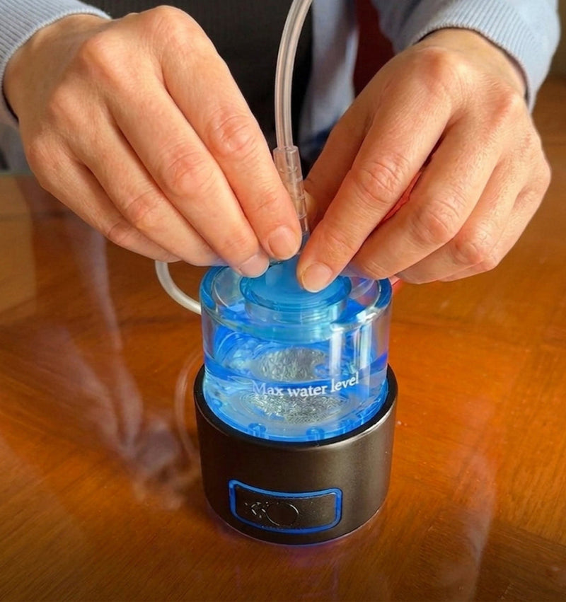 Person using a blue water level indicator on a wooden surface