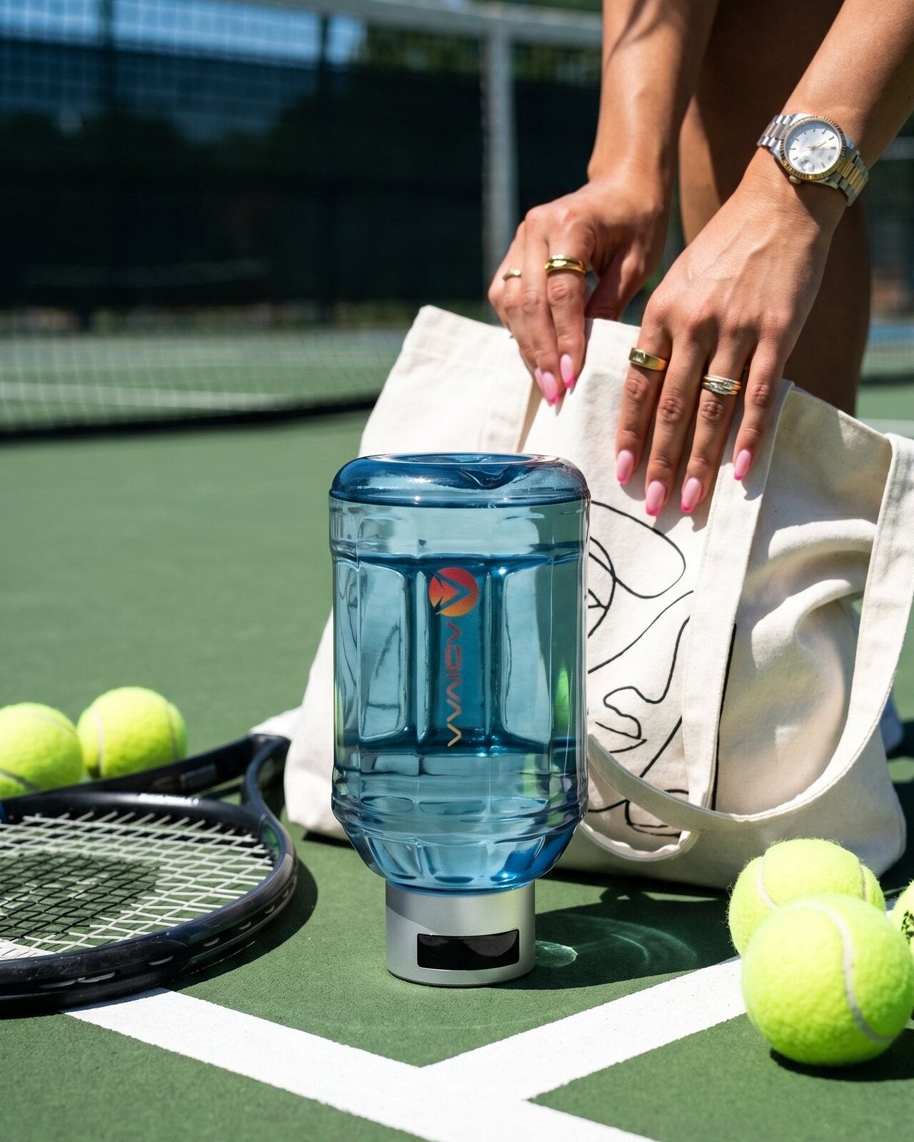 HydroBeast on a tennis court as a player packs her tote