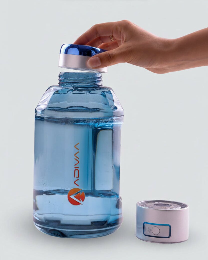Adivaa HydroBeast 1500 ml hydrogen water bottle in clear blue Tritan, the chrome drinking lid lifted off and the generator cap beside it