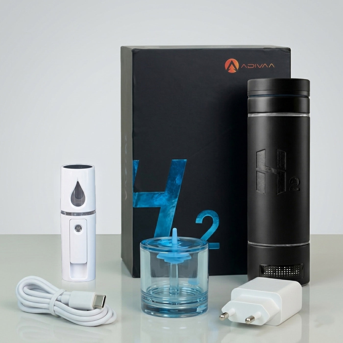 The HydroMax bottle with its mist sprayer, inhaler adapter, charging cable and plug