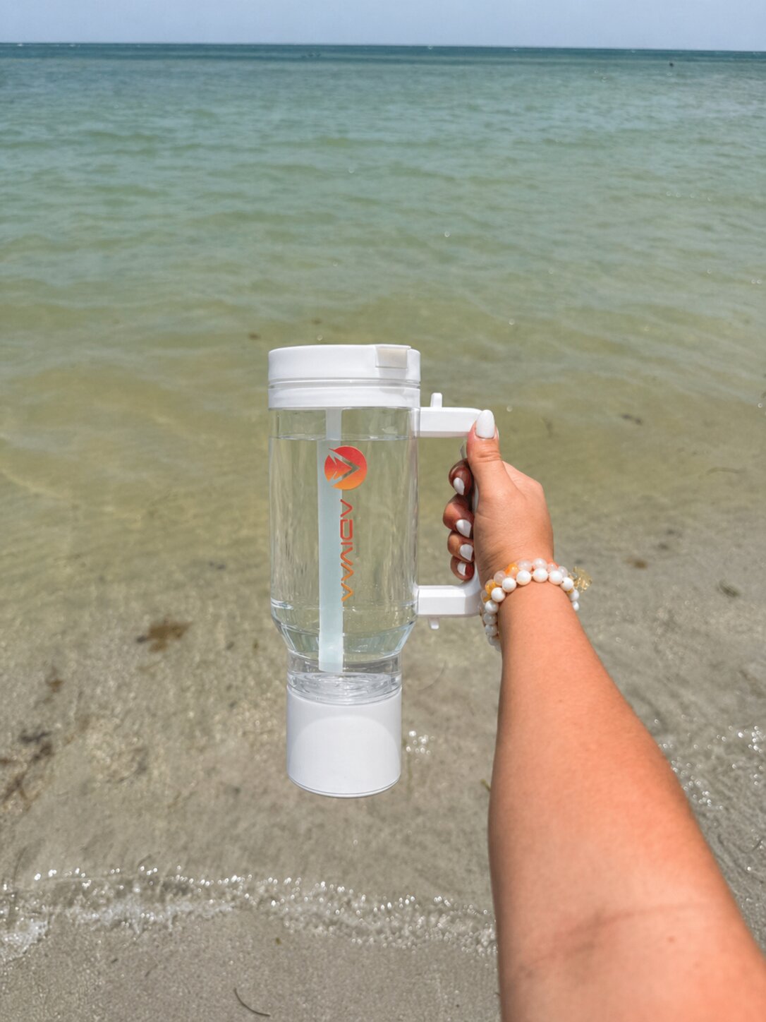 The white HydroSipr held out over the sea