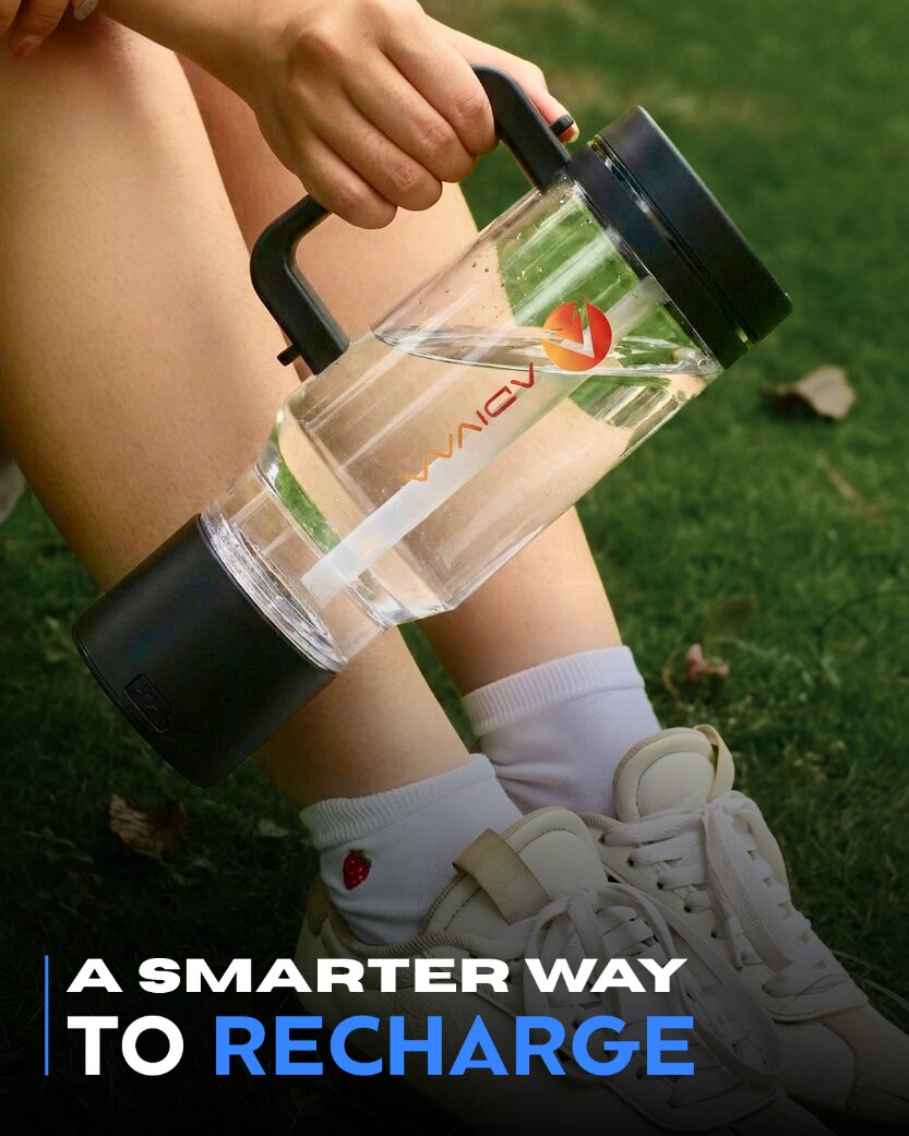 A smarter way to recharge: the black HydroSipr carried by its handle on the grass