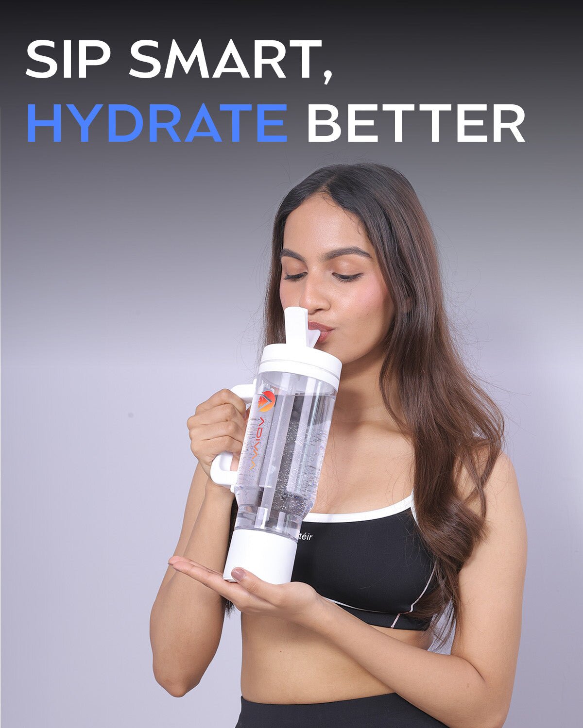 Sip smart, hydrate better: a woman sipping from the white HydroSipr's flip-top straw