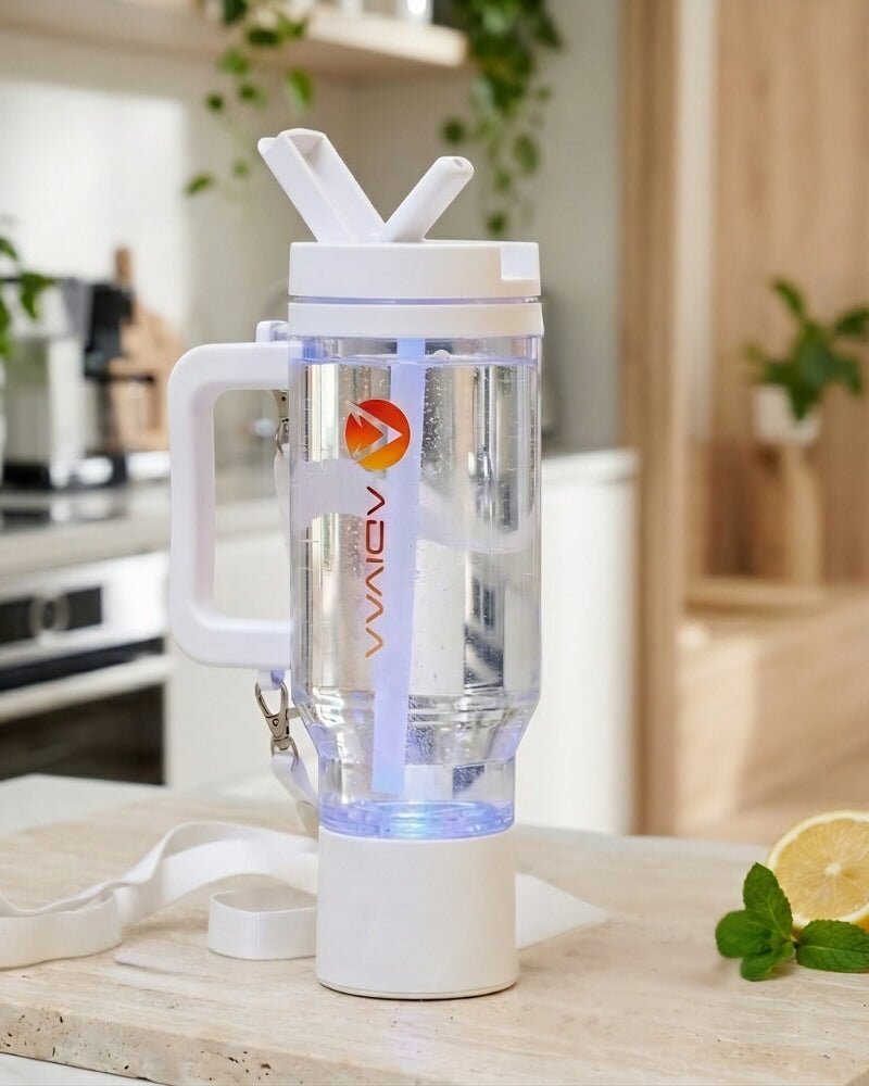 The white HydroSipr on a kitchen counter, its base glowing mid-cycle