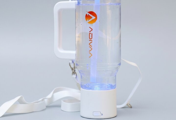 The white HydroSipr mid-cycle, its base glowing and hydrogen rising through the water