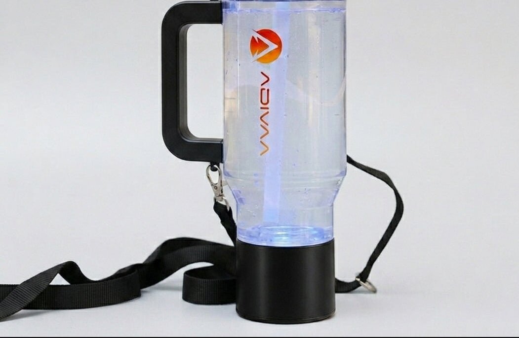 The black HydroSipr mid-cycle beside its shoulder strap, base glowing