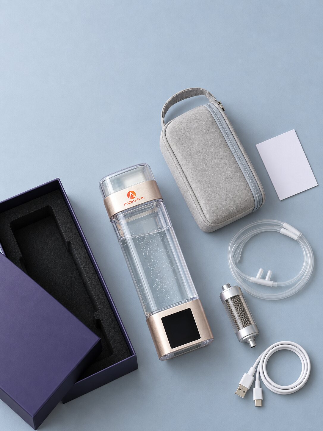 The kit laid out: bottle, cannula, spare cartridge, cable, pouch and gift box